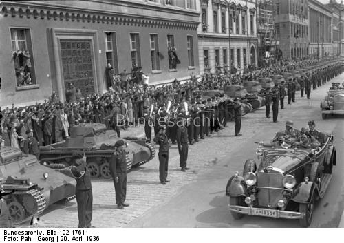 Adolf Hitler crosses Unter den Linden in his Mercedes and salutes Panzer troops on his 47th birthday